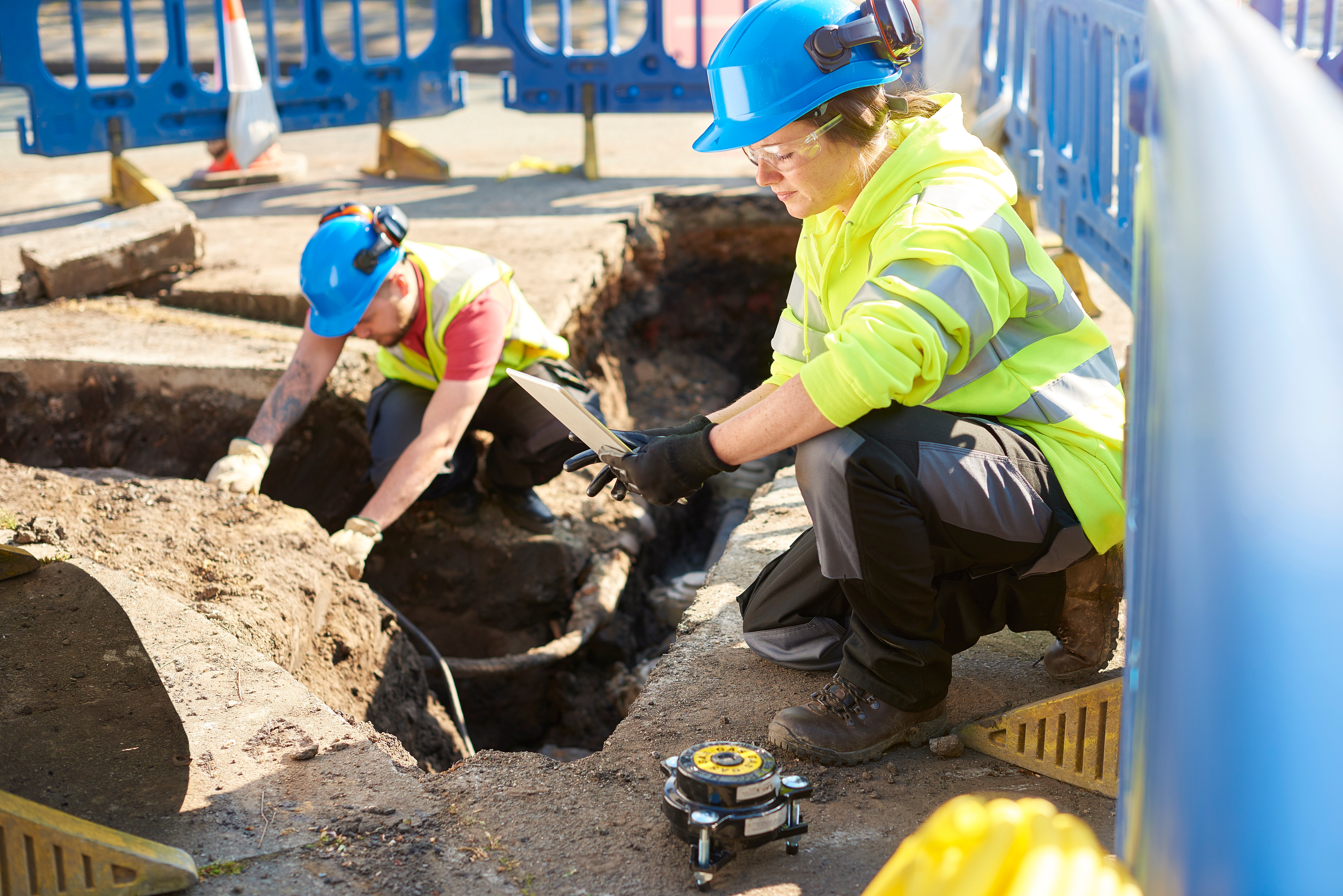 Utilities and construction field workers working at a site